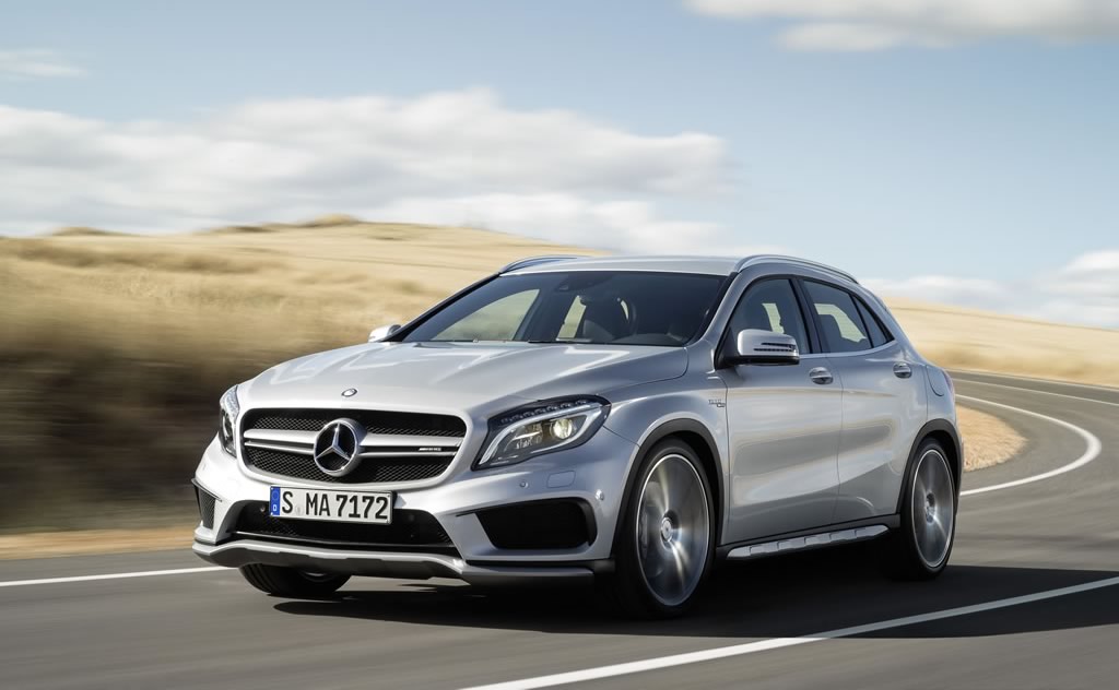 Mercedes-Benz GLA45 AMG in silver, driving front and side view